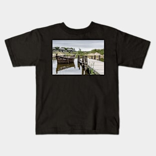 Peaceful landscape with lake and wooden boat Kids T-Shirt